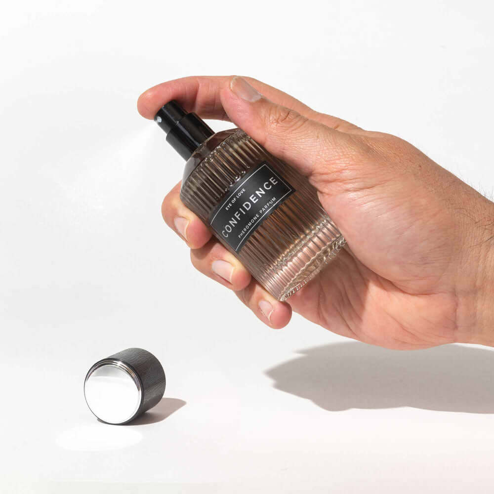 EOL-P-01DX_2 Confidence perfume bottle being sprayed