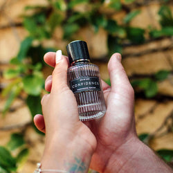 EOL-P-01DX_6 Confidence perfume bottle held in hands
