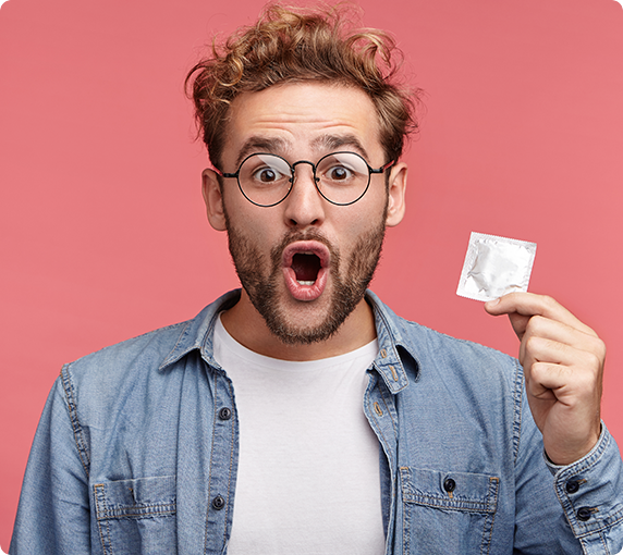 man holding condom packet