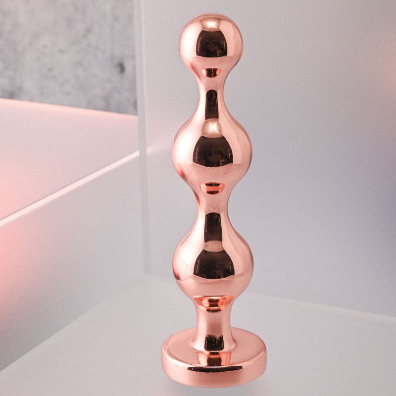 Gender X GOLD DIGGER Medium - Rose Gold Medium Butt Plug with Black Gem Base