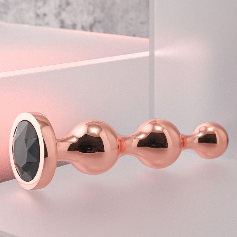 Gender X GOLD DIGGER Medium - Rose Gold Medium Butt Plug with Black Gem Base