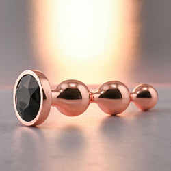 Gender X GOLD DIGGER SMALL - Rose Gold Small Butt Plug with Black Gem Base