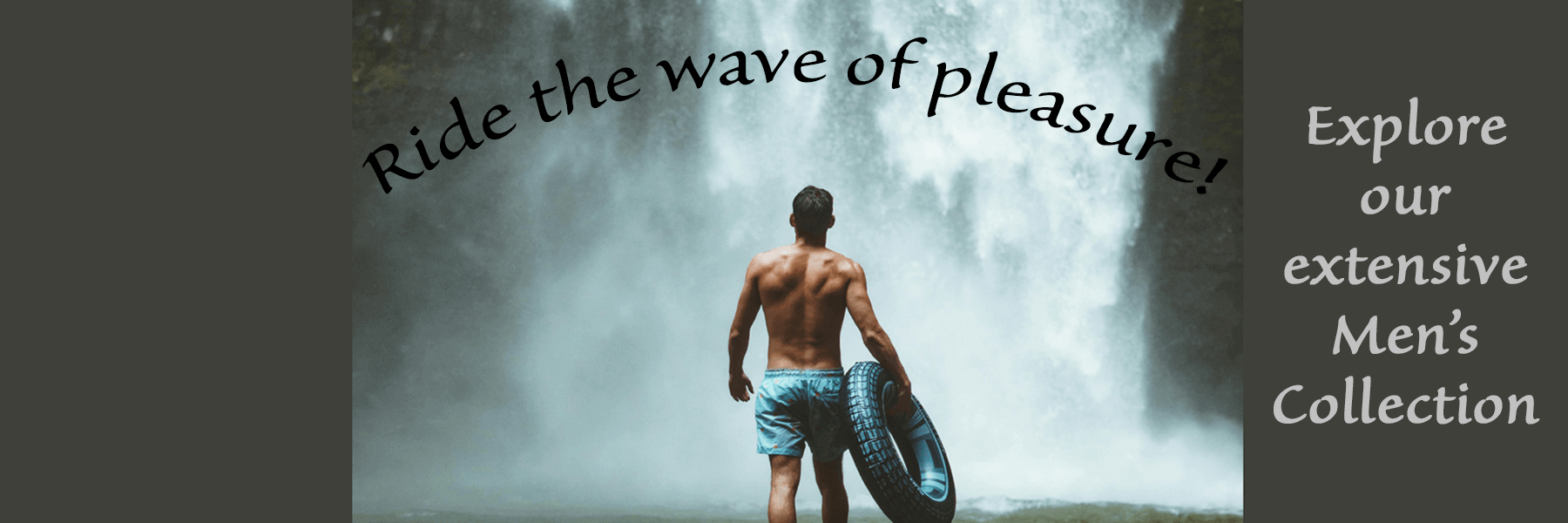 Man with tyre at waterfall